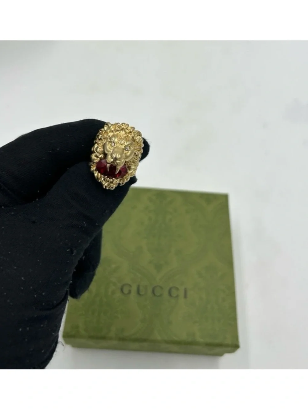 Unisex Gucci, Lionhead motif gold tone with red crystal size 8.5 made in Italy